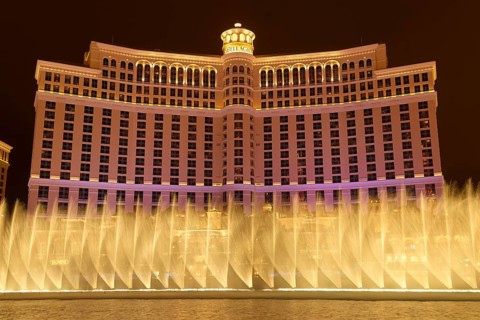 Illuminated Bellagio Hotel with water fountains in front of it at night, Las Vegas, Nevada, USA,