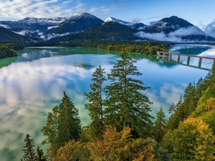 Snow-covered mountains reflected in lake, sunny, bridge, autumn, Sylvensteinsee, Karwendel
