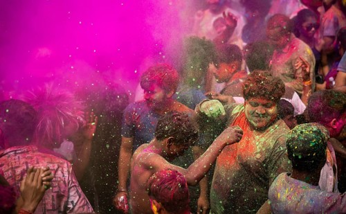 Revellers smear with Gulal or coloured powder and dance to play Holi, the Hindu spring festival of