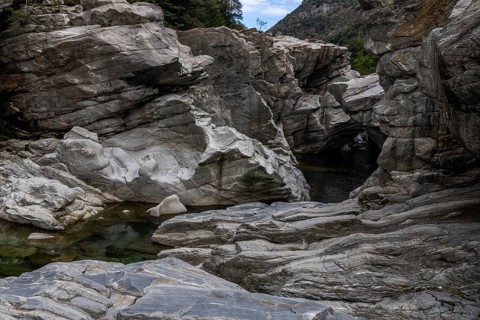 Rocks, granite rock formations in the Maggia River near Ponte Brolla, in the Maggia Valley, Valle