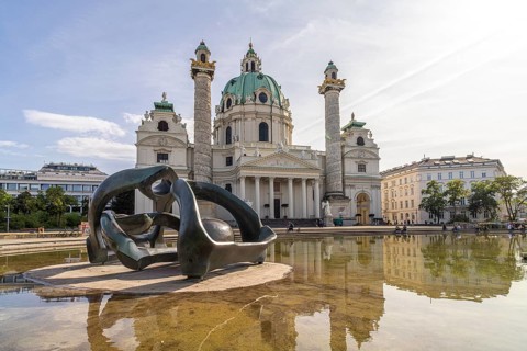Sculpture by Henry Moore Hill Arches and the Karlskirche in Vienna, Austria, Europe