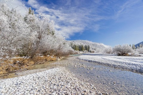 Isar valley in winter at temperatures of minus 18 degrees Celsius. Snow covered landscape with the