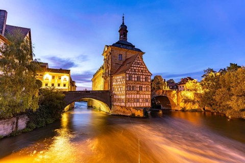 The Old Town Hall in the river Regnitz at dusk, Old Town of Bamberg, Upper Franconia, Bavaria,