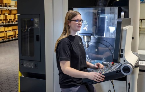 Oberhausen, North Rhine-Westphalia, Germany, Trainee woman in metalworking. Trainee cutting machine