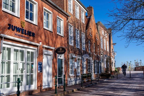 The fishing village of Greetsiel, municipality of Krummhörn, historic houses at the fishing
