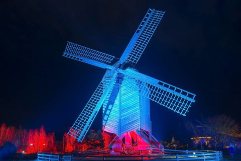 Illuminated windmill with red and blue effects at night, world of lights, illumination, mill