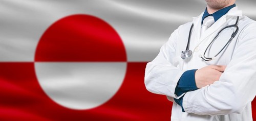 Greenland Health Care concept. Male doctor on Greenland flag. Doctor with crossed arms on Greenland
