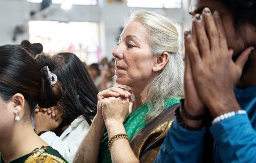 Devotees pray in church during a Christmas day sermon on December 25, 2024 in Guwahati, India.