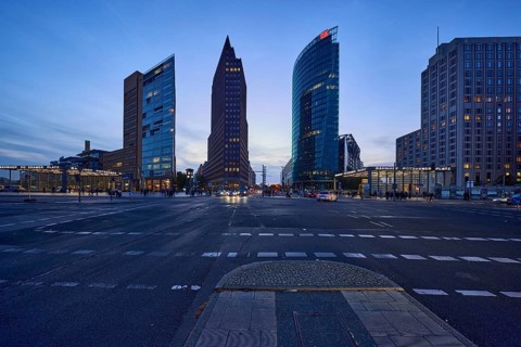 High-rise buildings Forum Tower, Kollhoff-Tower and Bahntower in the blue hour at Potsdamer Platz,