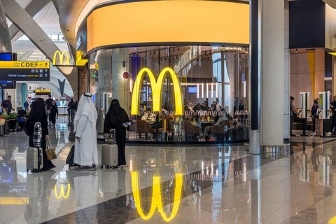 Abu Dhabi Airport, Zayed International Airport with passengers. McDonalds restaurant. The new