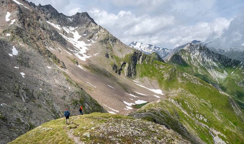 Two mountaineers on a hiking trail on the Mittagskögele, view of mountain peaks of the Venediger