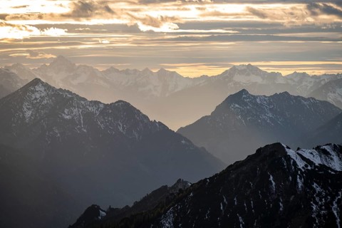 Mountain panorama with snow at sunset, in autumn, view from Kramerspitz, Bavarian Prealps, Bavaria,