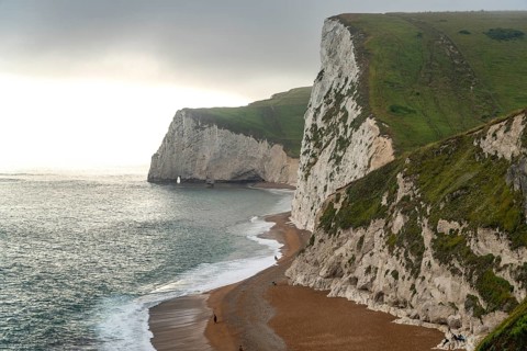 White cliffs and beach of the UNESCO World Heritage Site Jurassic Coast, England, Great Britain