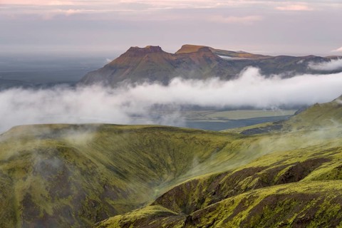 Fog between mountains, moss-covered volcanic mountain landscape, at sunset, Pakgil, Iceland, Europe