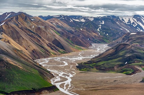 River between colourful rhyolite mountains, volcanic landscape, colourful erosion landscape, view