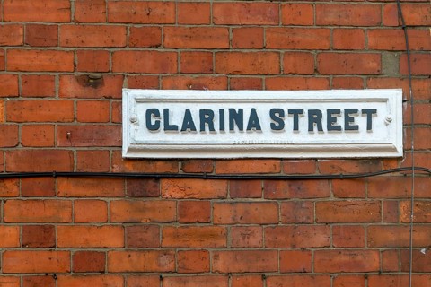 Victorian red brick terraced housing, street sign Clarina Street, inner city of Lincoln,
