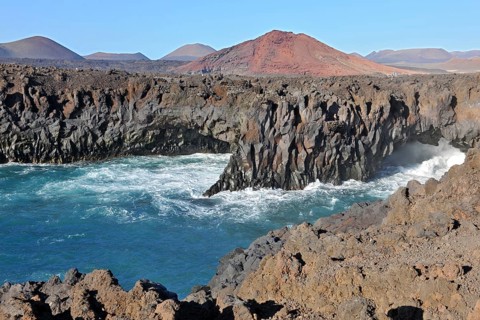 Rugged rocky coastline created by prehistoric volcanic activity Volcanism in early history Bay of