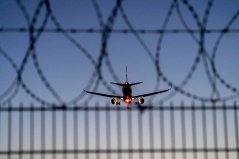 Symbolic image security at the airport, outer fence at Düsseldorf International Airport, steel wire