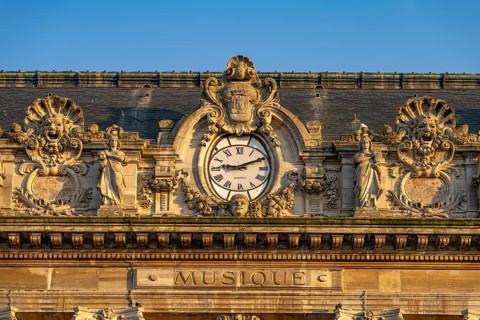 Clock and details of the theatre of Calais, France, Europe