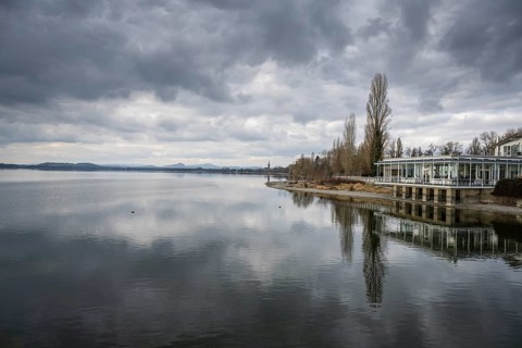 View over Lake Constance, on the right the Strandcafe restaurant on the Mettnau peninsula, on the