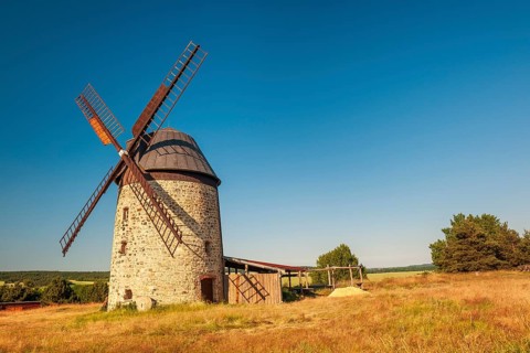 The tower windmill of Warnstedt in the evening light under a blue sky, Teufelsmühle, Thale,