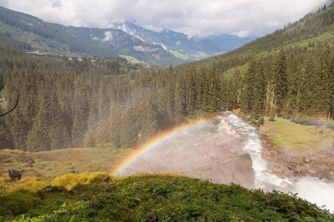 Krimml Waterfalls with rainbow. They have a total height of 380 metres (1, 247 feet) and are the