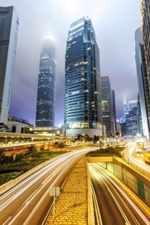 Hong Kong at night traffic with streets and skyscrapers in Hong Kong, China, Asia