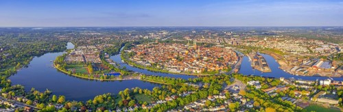 Aerial view over the river Trave and church towers in the old town of the Hanseatic City of Lübeck