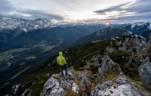 View Mountain panorama with Wetterstein mountains and Zugspitze, at sunset with sun star,