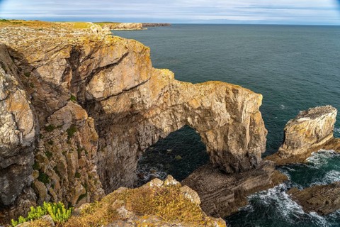 The natural rock bridge Green Bridge, Pembrokeshire Coast National Park, Pembrokeshire, Wales,
