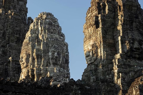 Panoramic image of giant stone-carved faces of the Bodhisattva Lokeshvara, also known as