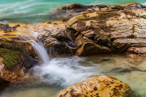 The Riss creek flowing through an autumnal landscape in the Eng valley