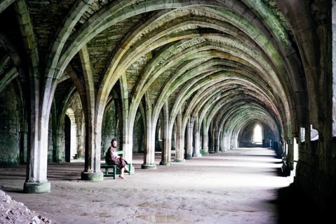 Woman in the cloisters of Fountains Abbey, North Yorkshire, England, 1963