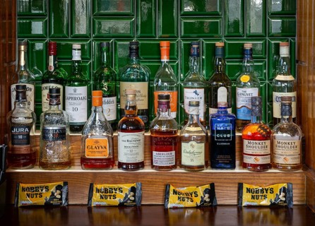 Bottles of different whisky brands, Crown Hotel pub in city centre of Liverpool, England, UK