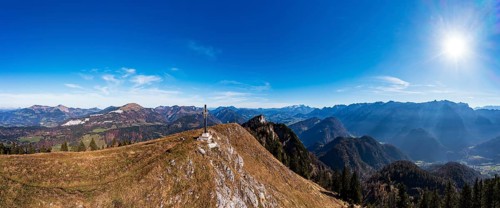 Drone shot, summit cross on the Schwarzer Berg with a view of the Lammertal with Dachstein massif
