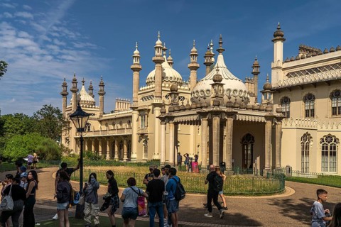Students in front of the Royal Pavilion in the seaside resort of Brighton, England, Great Britain