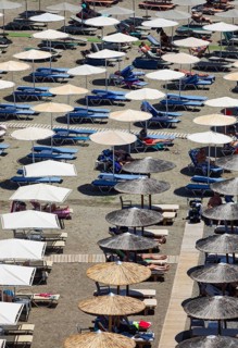 Parasols on Agia Galini beach, Agia Galini, south coast, Crete, Greece, Europe