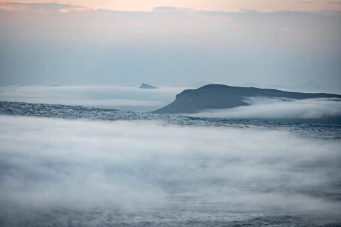 Fog over the glacier ice of Myrdalsjökull glacier, at sunset, Pakgil, Iceland, Europe