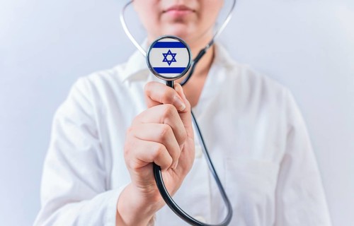 Doctor showing stethoscope with Israel flag. Israel National Healthcare concept