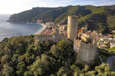 The castle Castello di Monte Ursino, Noli and the coast seen from the air, Noli, Riviera di