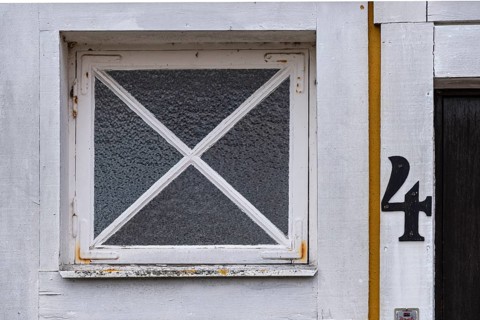 The number 4 on a front door next to a window, Karlskrona, Blekinge län, Sweden, Europe