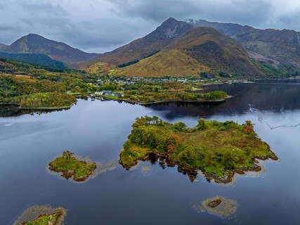 Mountains reflected in fjord, coast, island, autumn, cloudy, aerial view, Loch Leven, view of