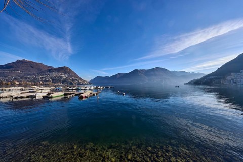 Lake, marina, jetties, motorboats, mountains, haze, blue sky, cirrostratus clouds, Lake Lugano,