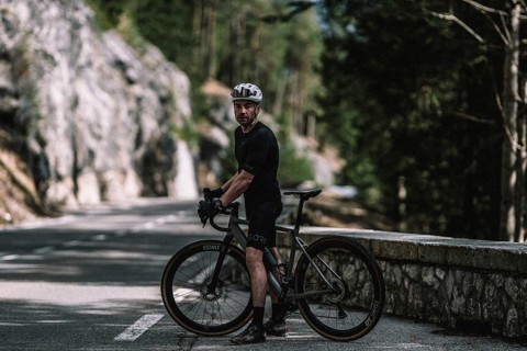 Road bike rider in spring between Lechtal and Tannheimer Tal in front of picturesque scenery of the