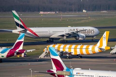 Düsseldorf Airport, Emirates Boeing 777 and Eurowings Airbus, Condor, aeroplanes on the apron,