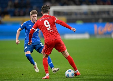 tackle, action Alexander Prass TSG 1899 Hoffenheim (22) against Lucas Höler SC Freiburg SCF (09)