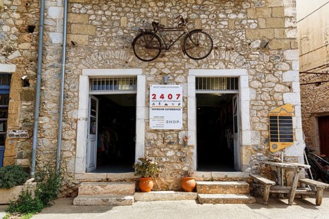 Facade with bicycle, outdoor activities, logo 2407, typical stone house in Stoupa, former fishing