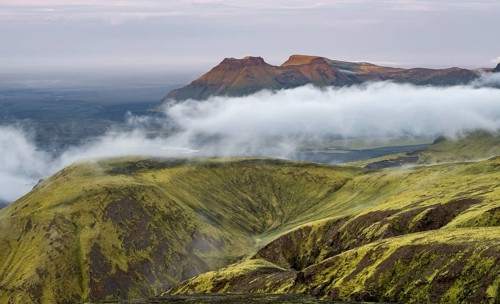 Fog between mountains, moss-covered volcanic mountain landscape, at sunset, Pakgil, Iceland, Europe