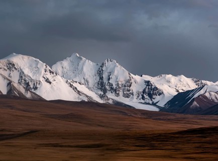 Glaciated and snow-capped mountains, dramatic landscape, high plateau, autumnal mountain landscape