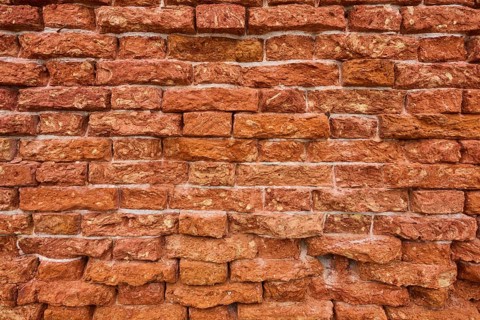 Detail of an old ziggurat wall made of bakestone bricks, Venice Italy